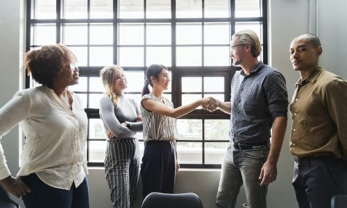 Boss shaking hands with a new team member